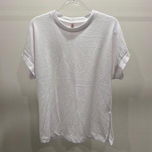 mono b white t shirt with slit on sides, size medium!